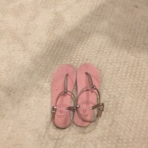 Rose gold flip flops